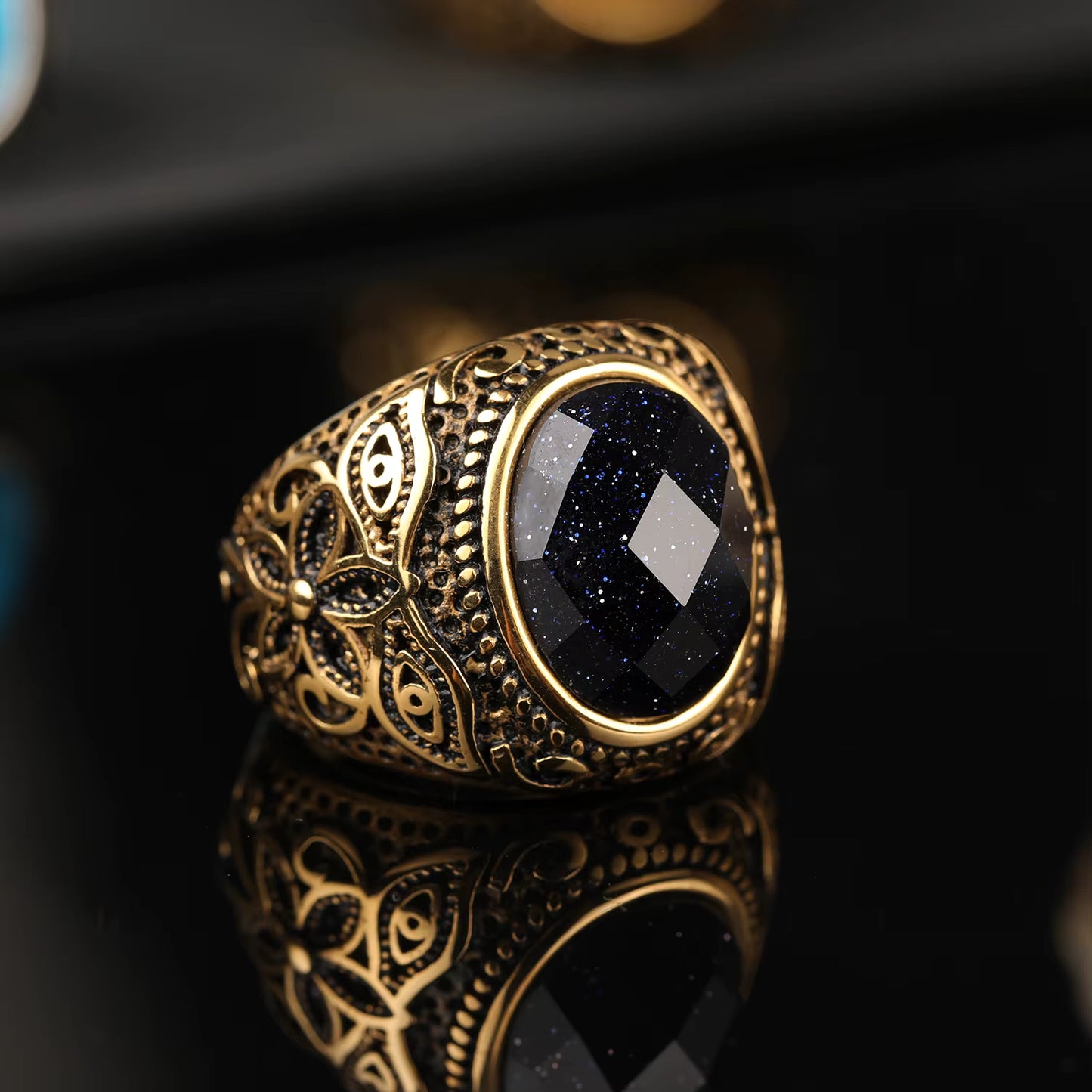 ANILLO CON PIEDRA Y BANDA DE FLOR